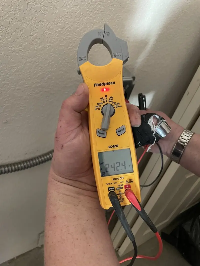 Voltage testing with clamp meter during Recessed Lighting Installation in Upper Dublin
